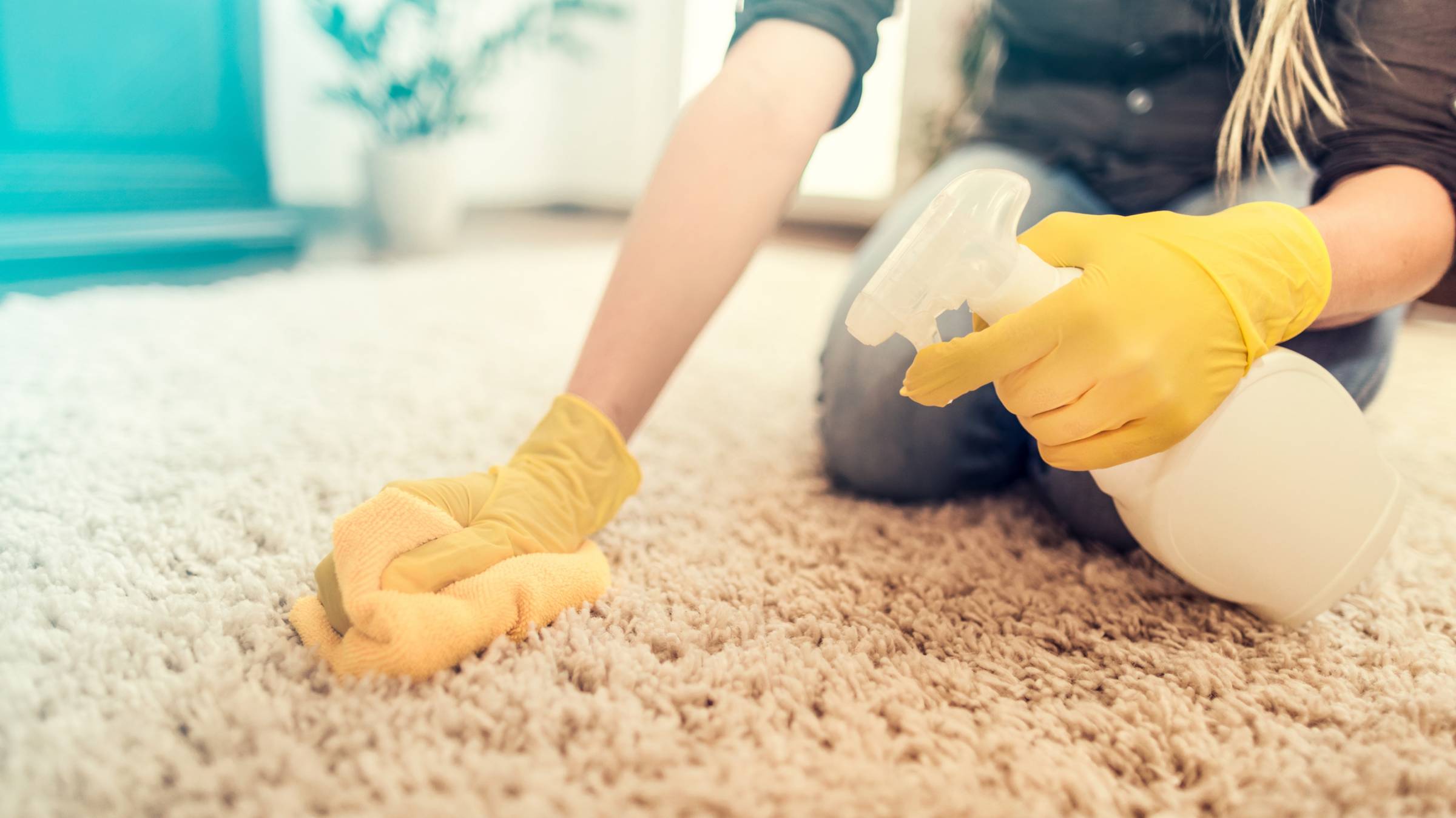 a woman cleaning carpet