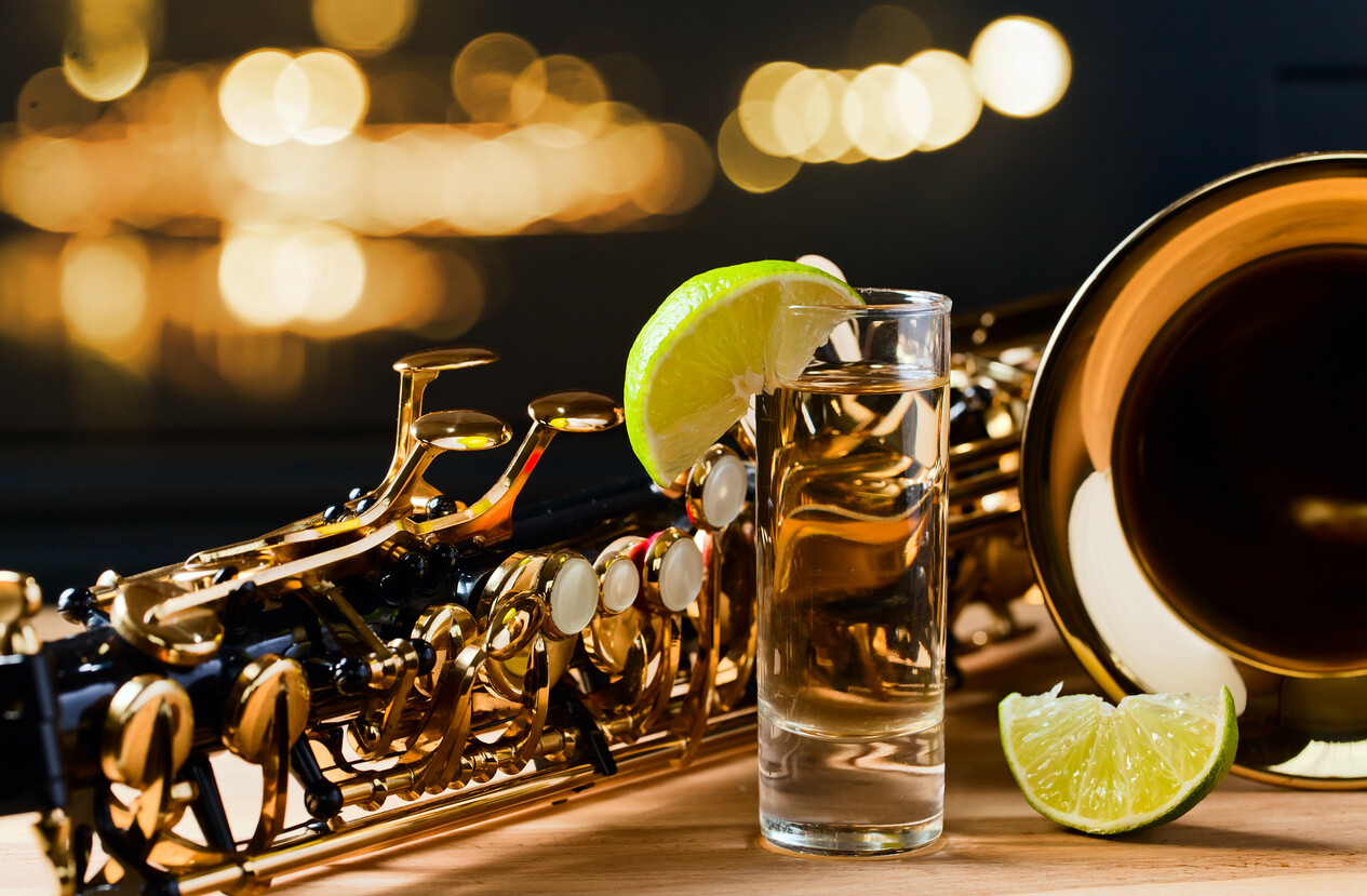 alcoholic beverage beside a musical instrument