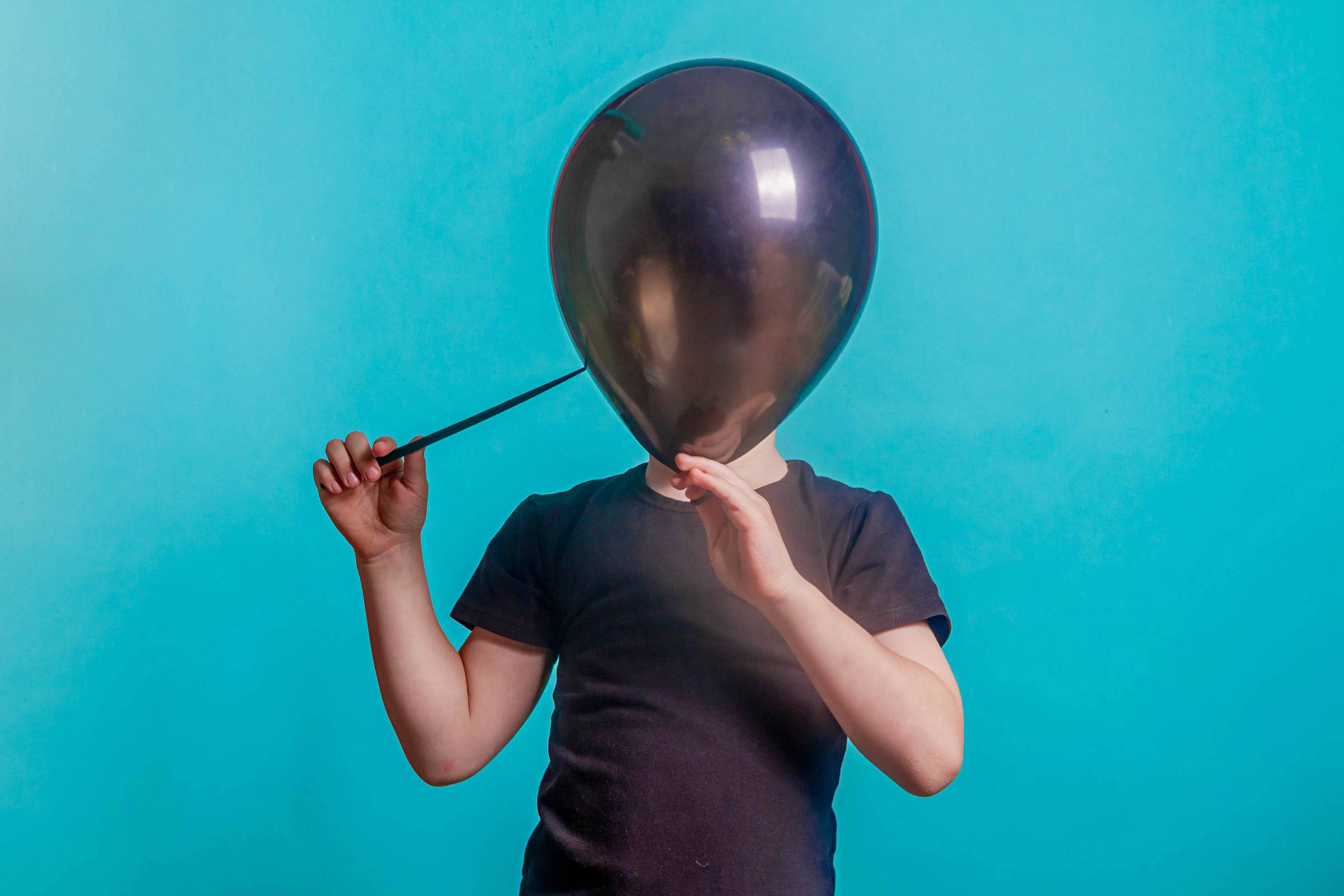 a boy with a balloon
