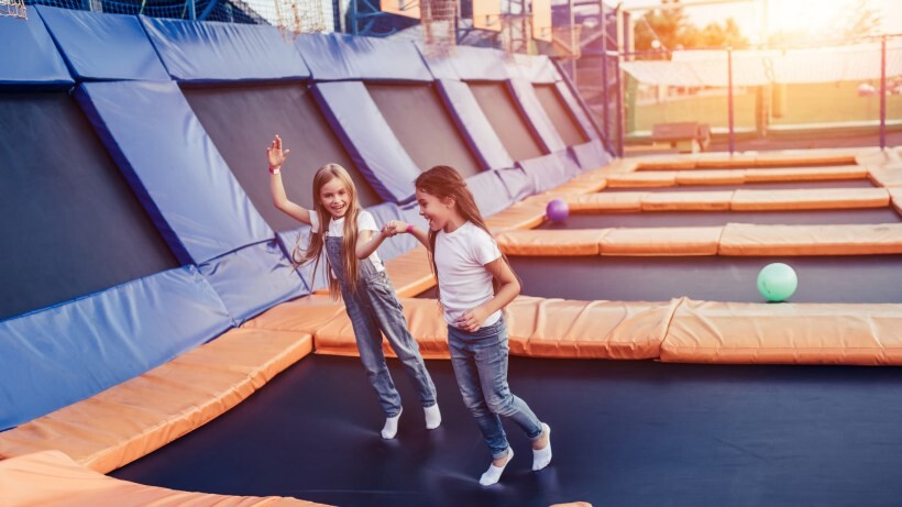 rectangle vs round trampoline: little pretty girls having fun on a trampoline