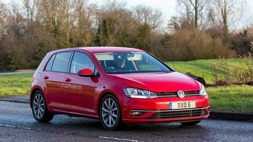 hatchback vs sedan - a red Volkswagen Golf hatchback