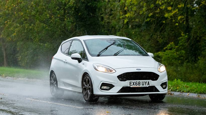 hatchback vs sedan - a Ford Fiesta in the rain