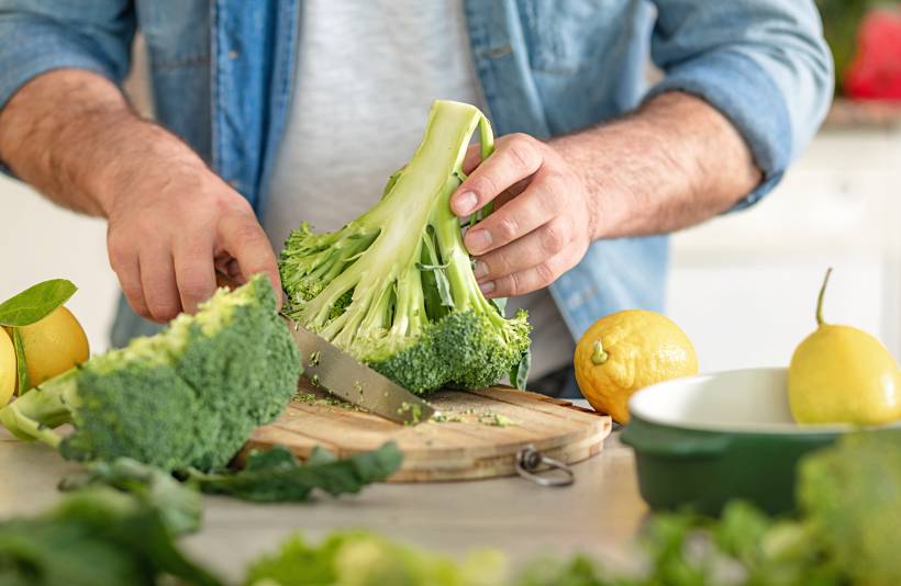 broccoli vs. broccolini - a man preparing to cook broccoli