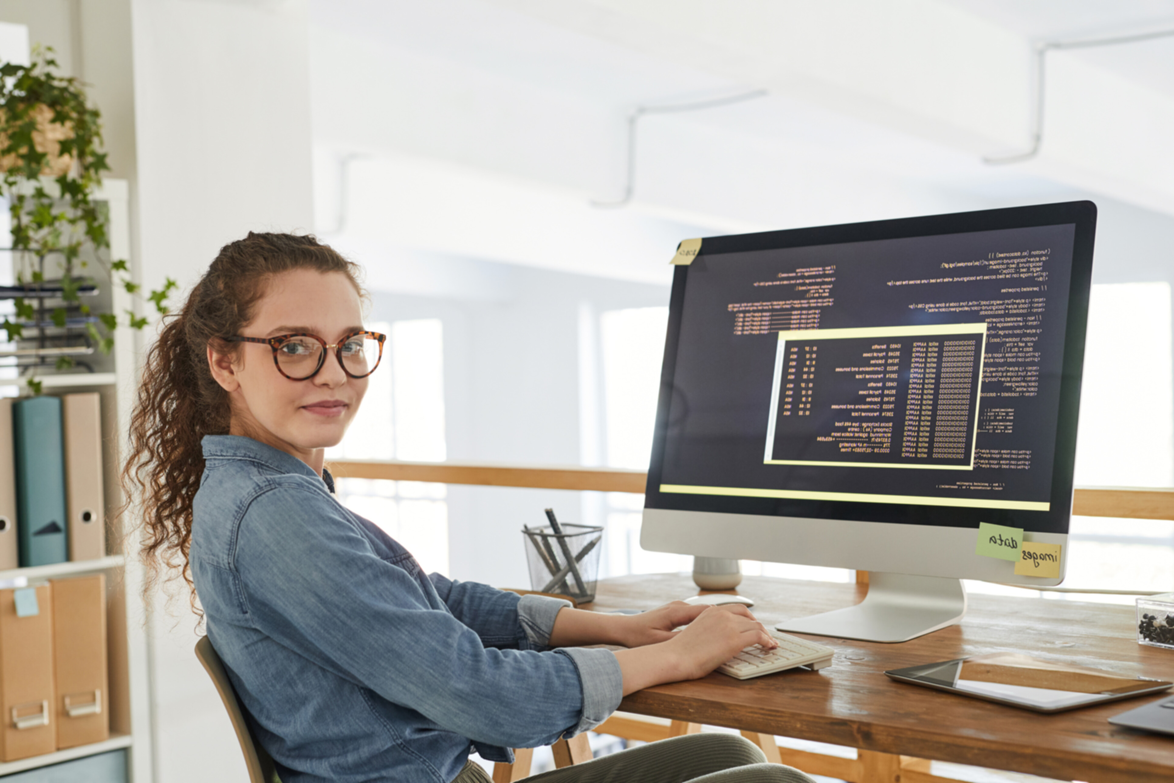 A female web developer working at her desk.