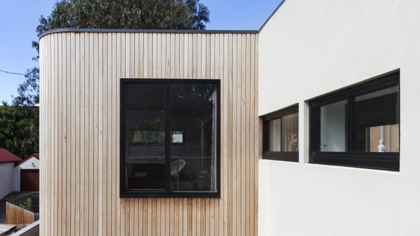 Wall cladding vs wall panelling - Close up of timber cladding slats on exterior renovation