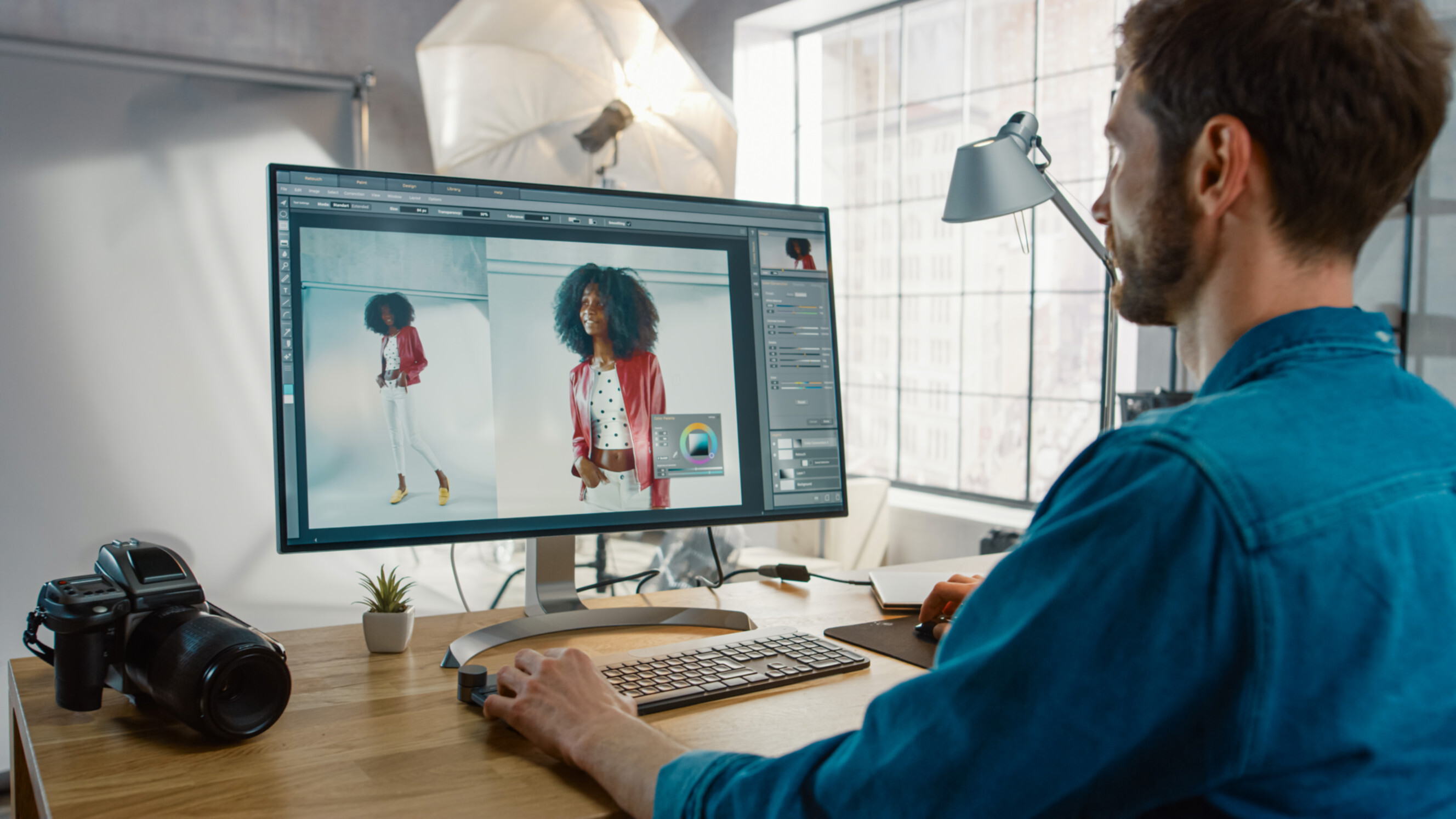 Adobe Photoshop designer near me editing a fashion photo on a large monitor with professional photography equipment on the desk.