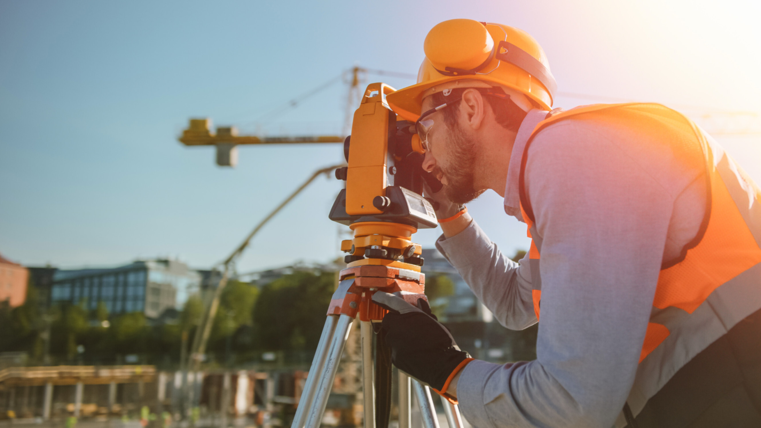 Building surveyor near me inspecting a construction site ensuring structural integrity and compliance with regulations.