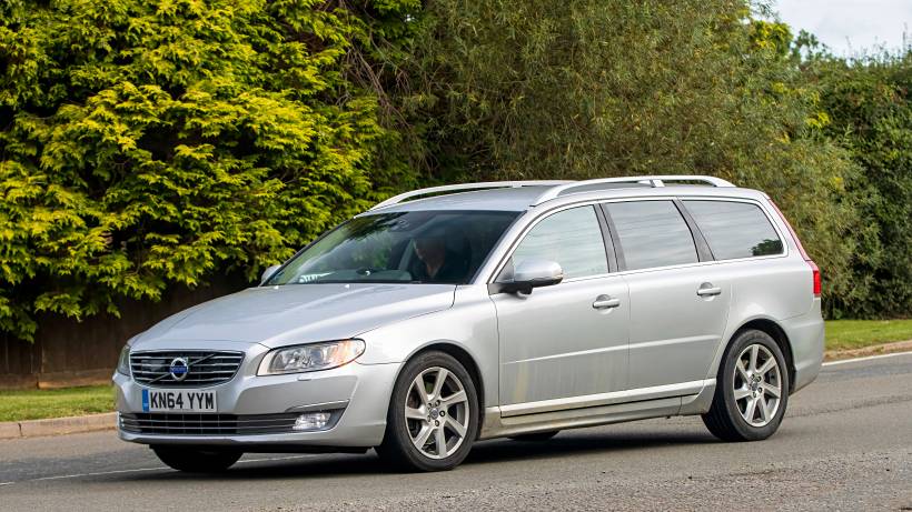 station wagon vs SUV - a silver Volvo station wagon on an English country road