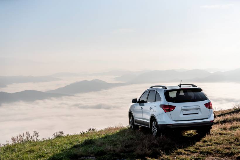 estate vs SUV - a white SUV on a mountain road