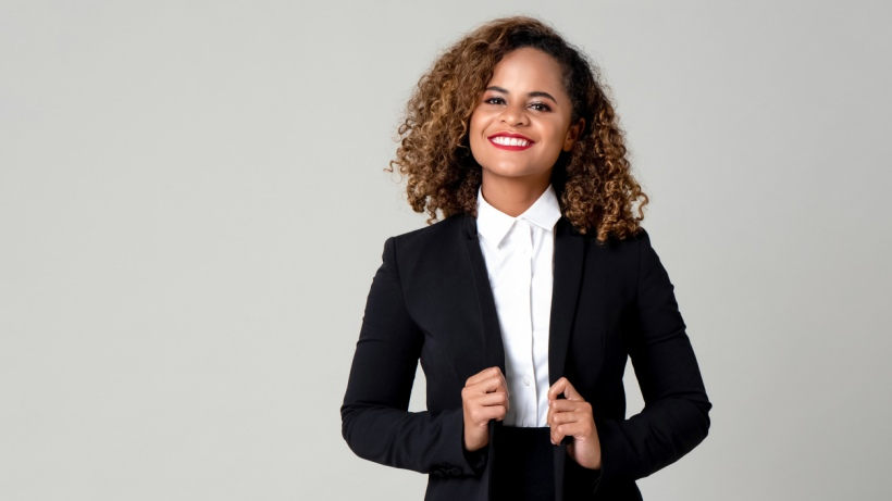 Tailored fit vs slim fit - A happy smiling person posing in a formal business attire