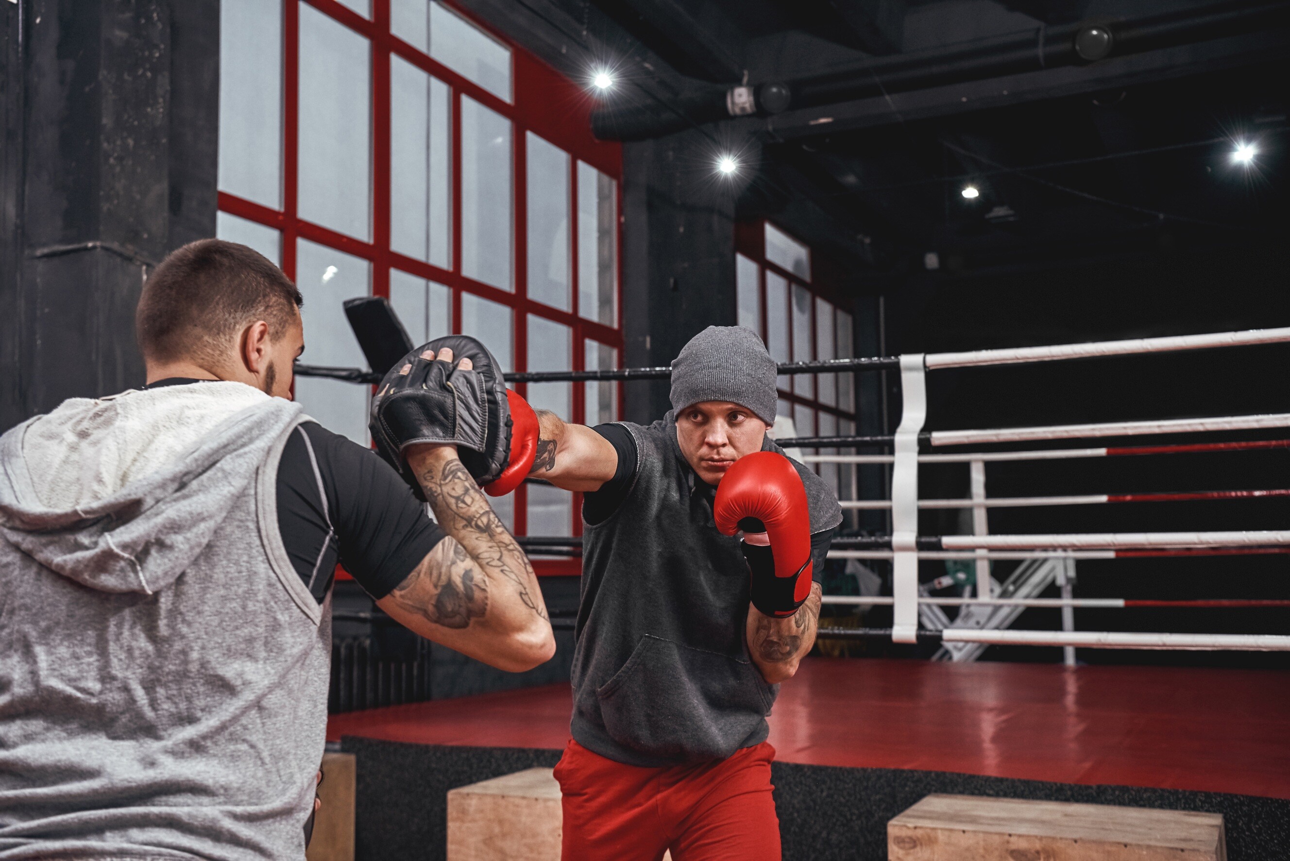 A boxing training session in what appears to be a gym or boxing studio