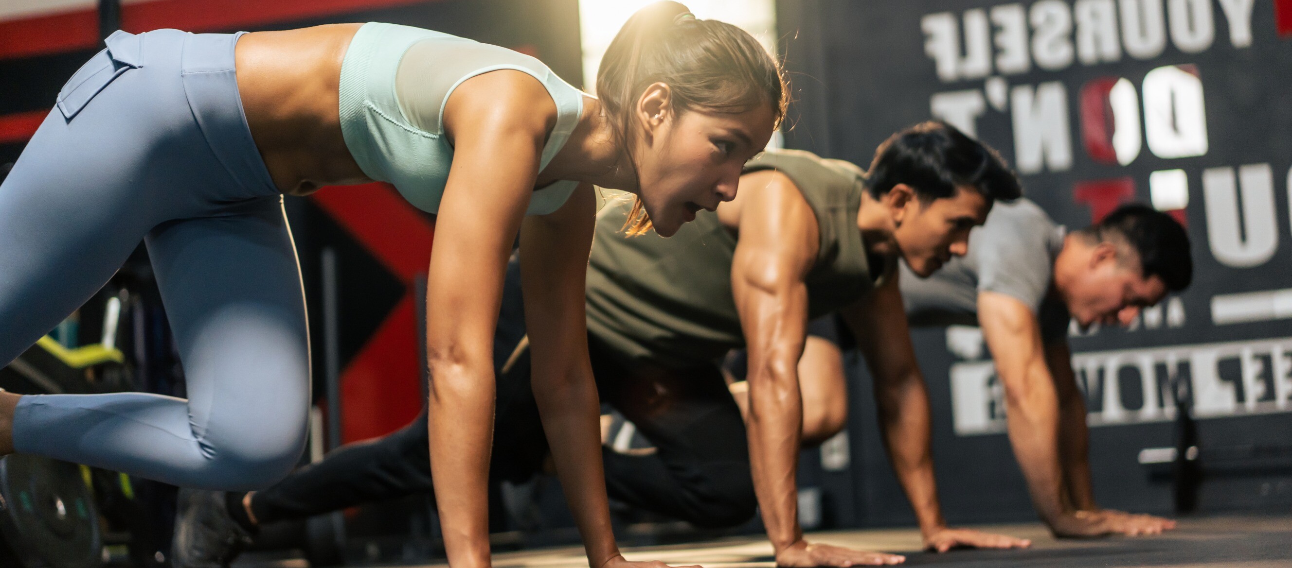 A high-intensity interval training (HIIT) workout session taking place in a gym or fitness studio