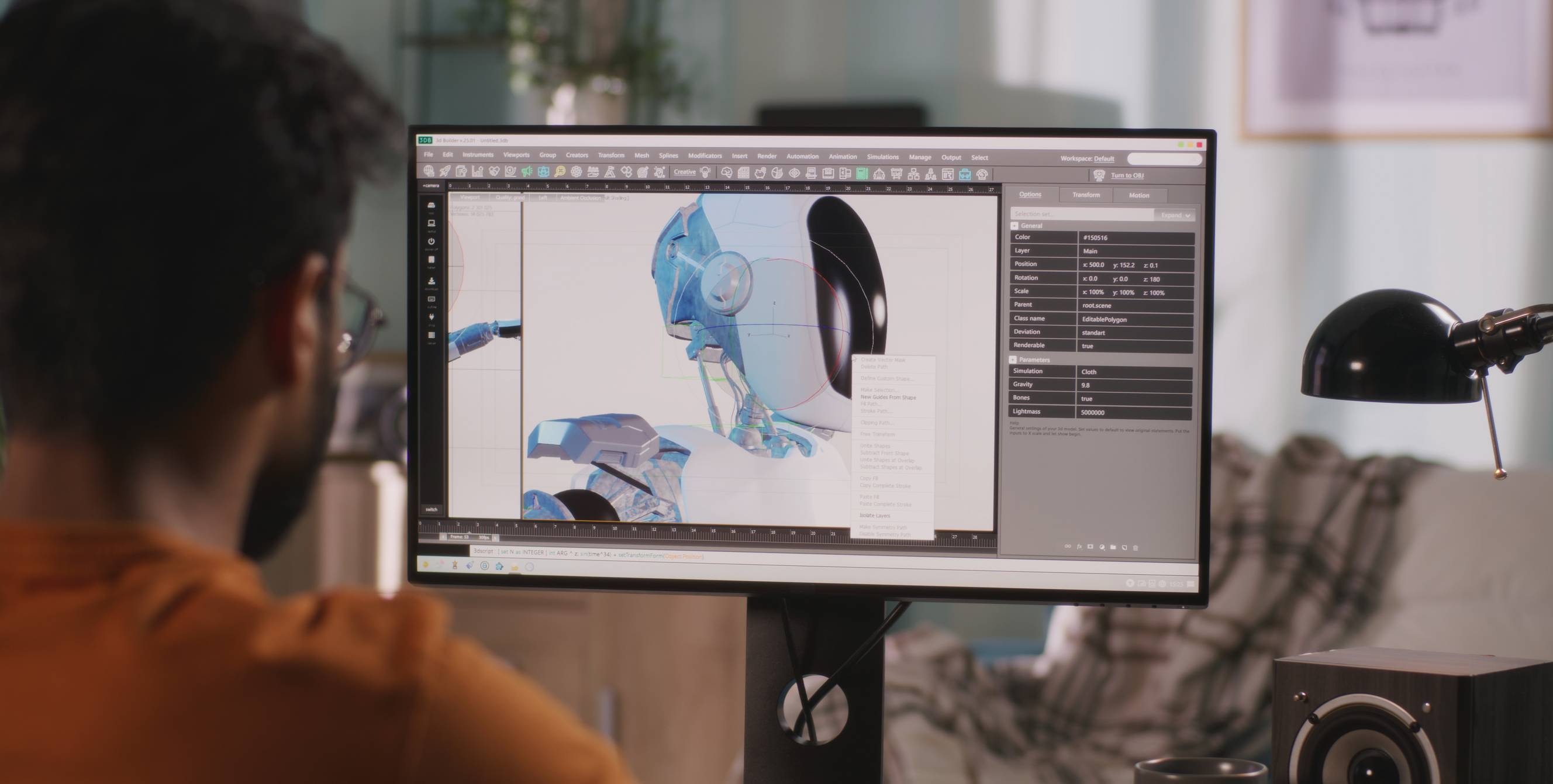 A professional creating a 3D model design of a robot on his computer.