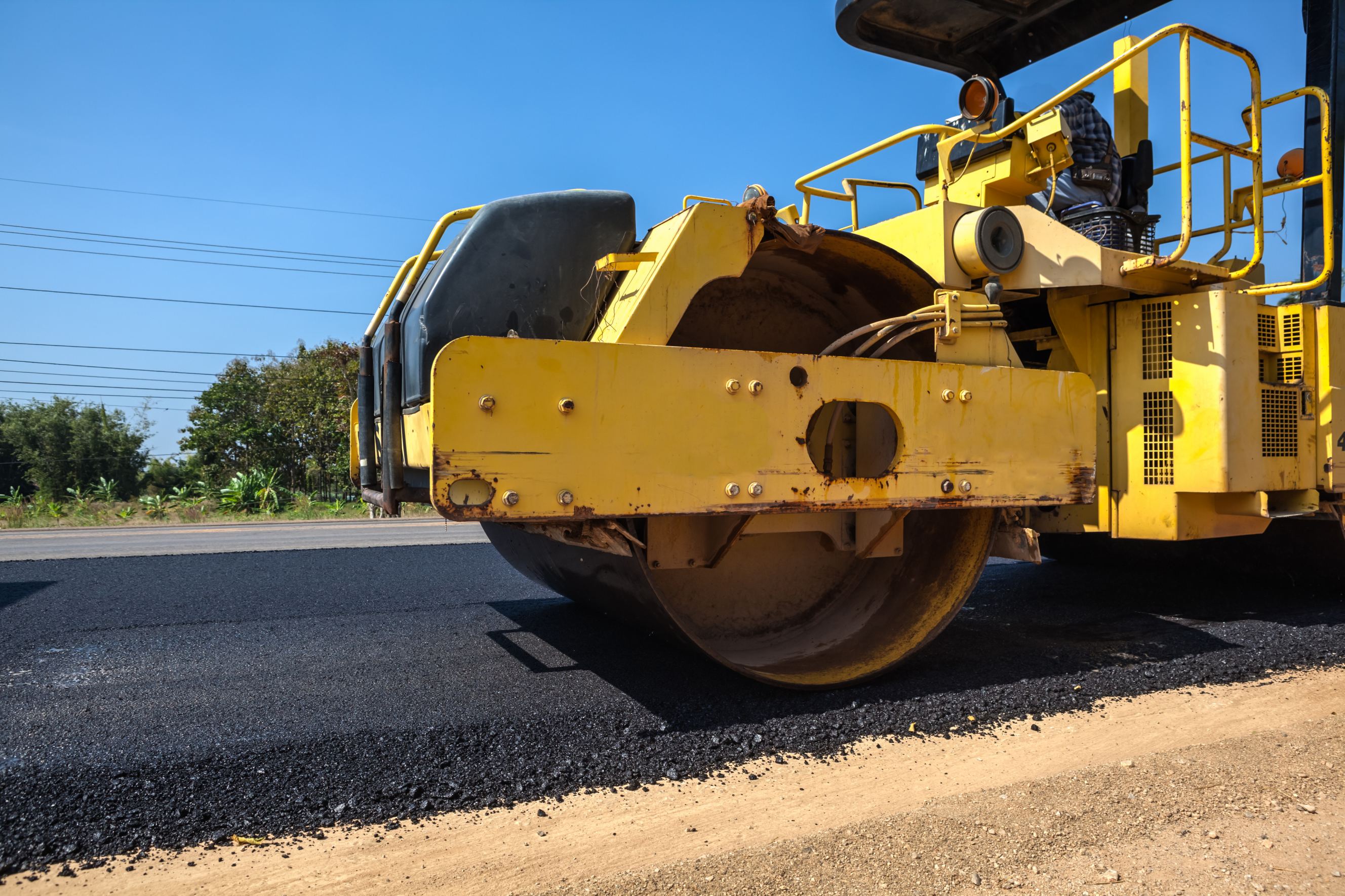 An asphalt roller to keep the asphalt driveway well-pressed.