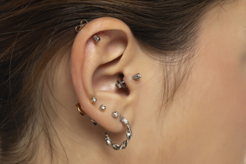 ear piercing cost - woman getting a tragus piercing