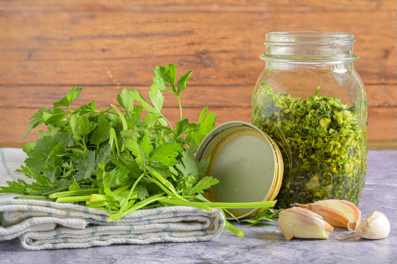 parsley vs coriander - Jars of preserved herbs including parsley and coriander