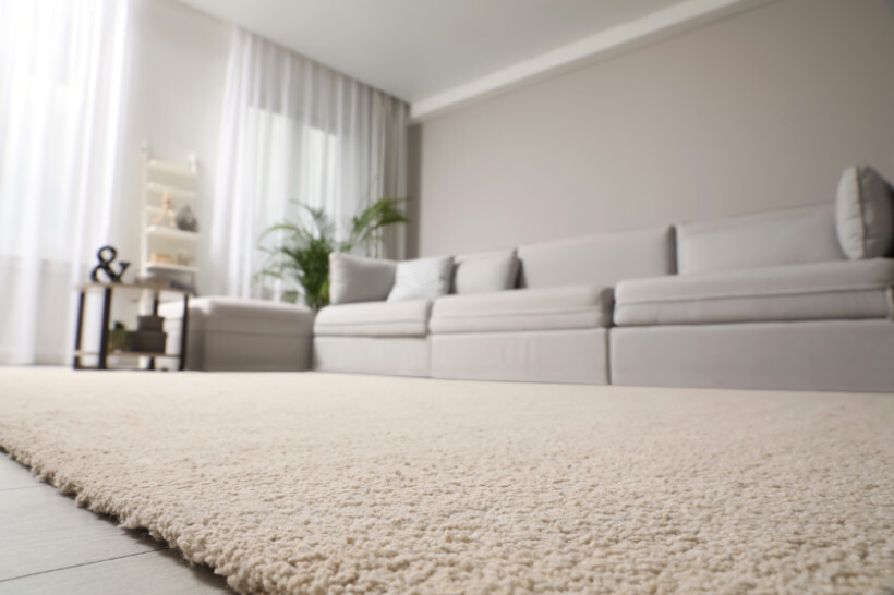 carpet vs tile flooring - Close-up of carpet flooring in a cozy room