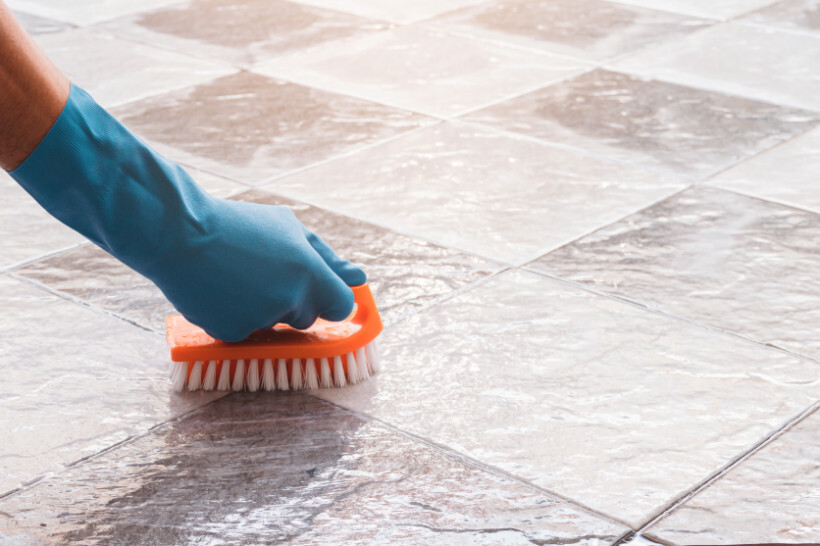 carpet vs tile flooring - Cleaning tiles with a scrub brush