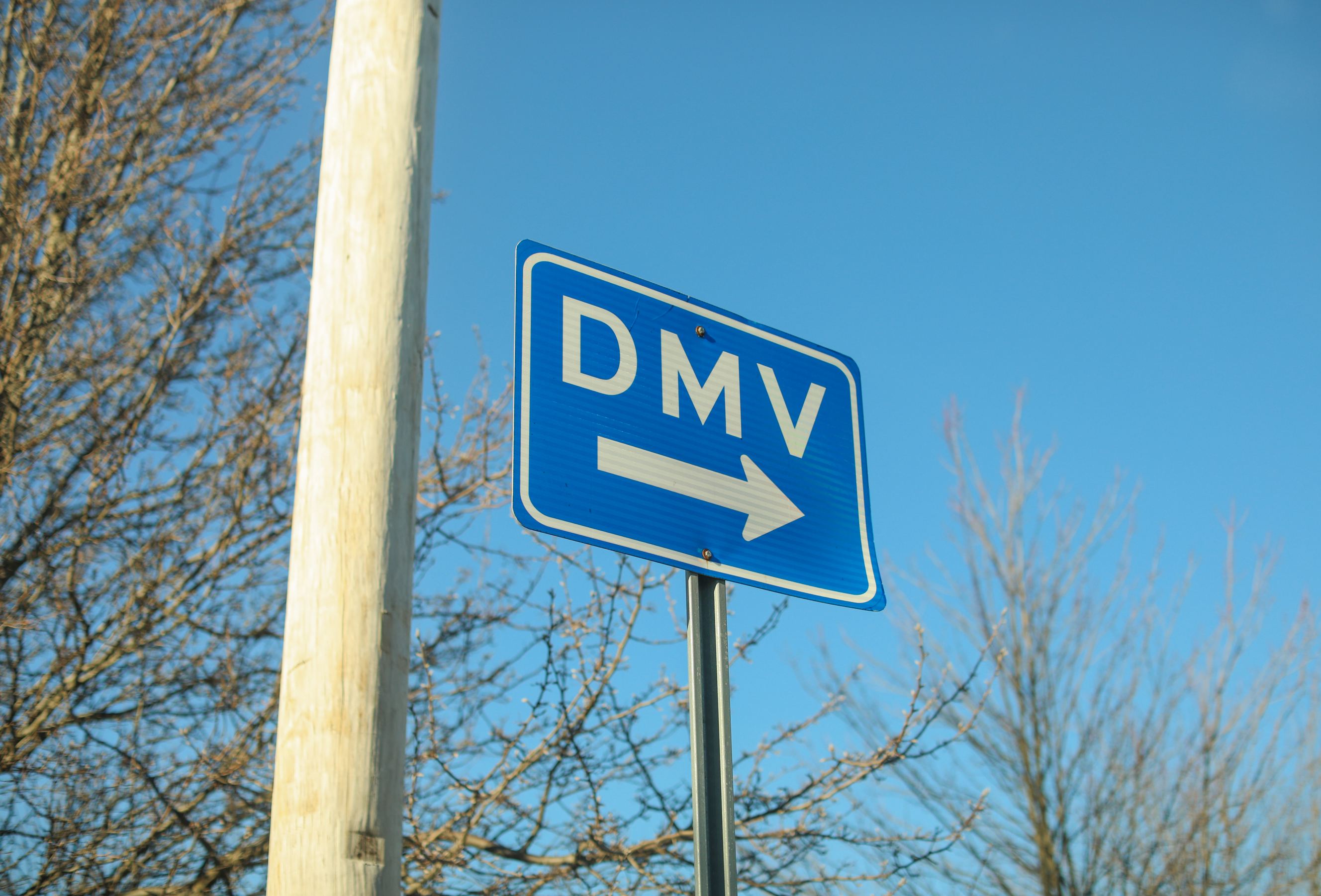 DMV sign street showing where to get driver registration.