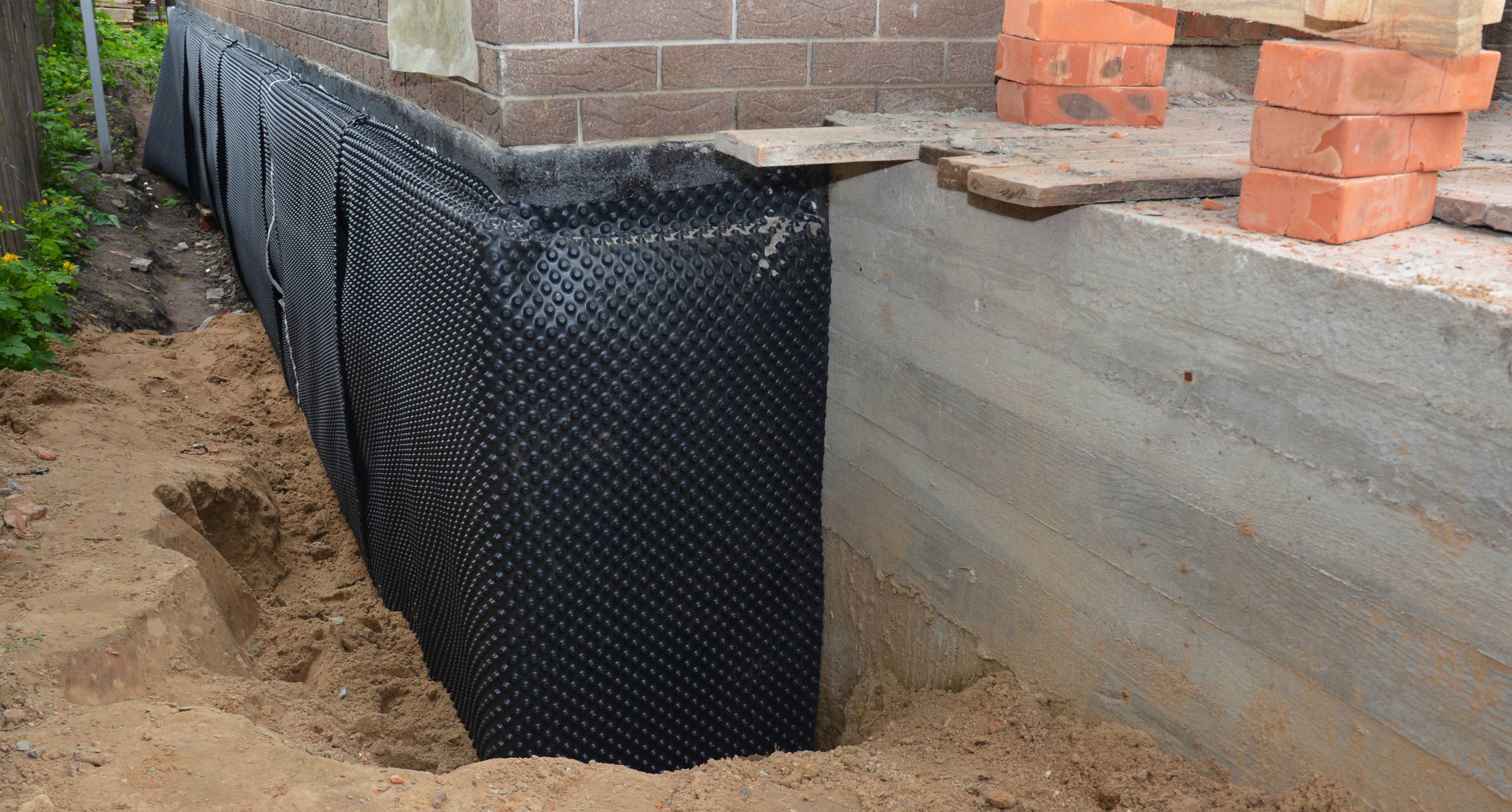 Basement waterproofing done a house foundation using a dimple mat.