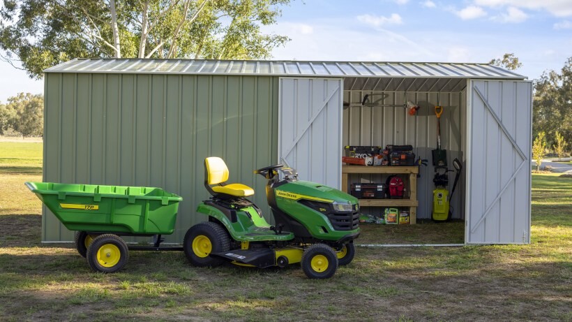 Barn vs shed - A compact and practical shed by Easyshed, featuring open double doors and a neatly organised interior with tools, gardening equipment, and outdoor essentials