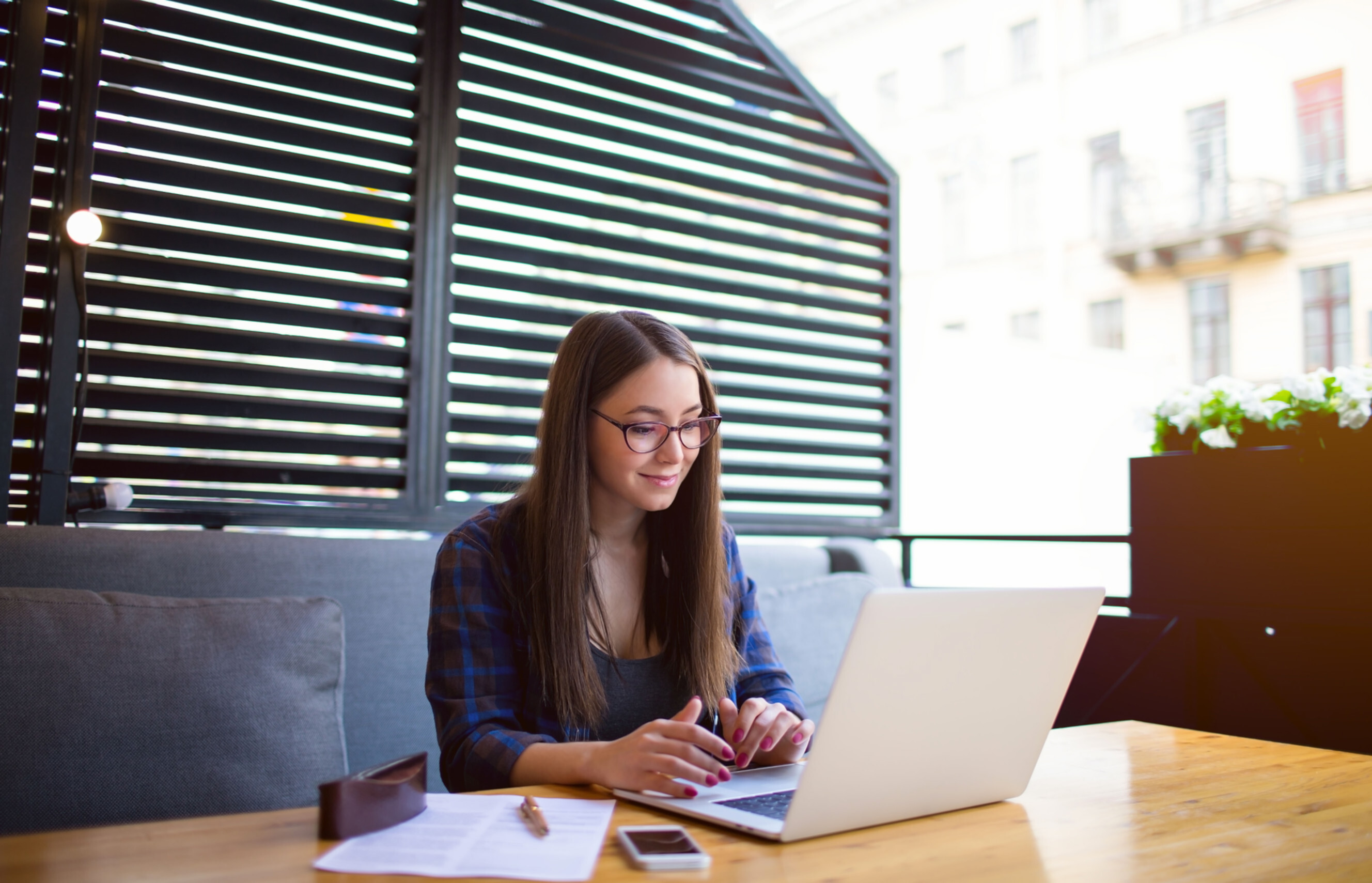 Digital marketer working on a laptop in a modern workspace, showcasing professional digital marketing services near you.