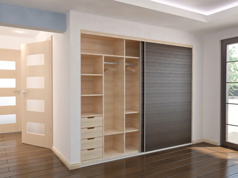 built-in wardrobes cost - Sliding doors on a built-in wardrobe in a modern bedroom