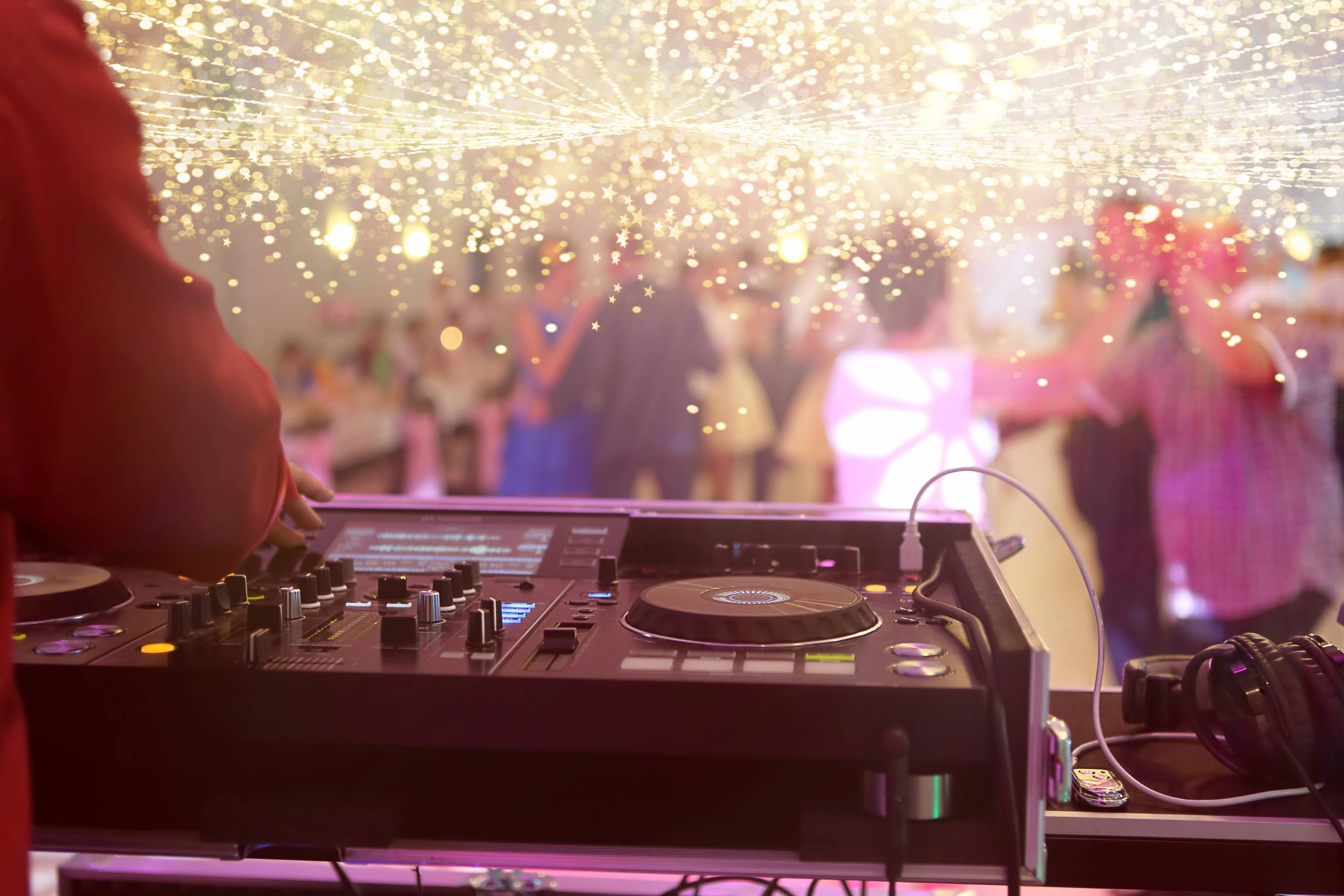 A wedding DJ near me performing during a wedding reception