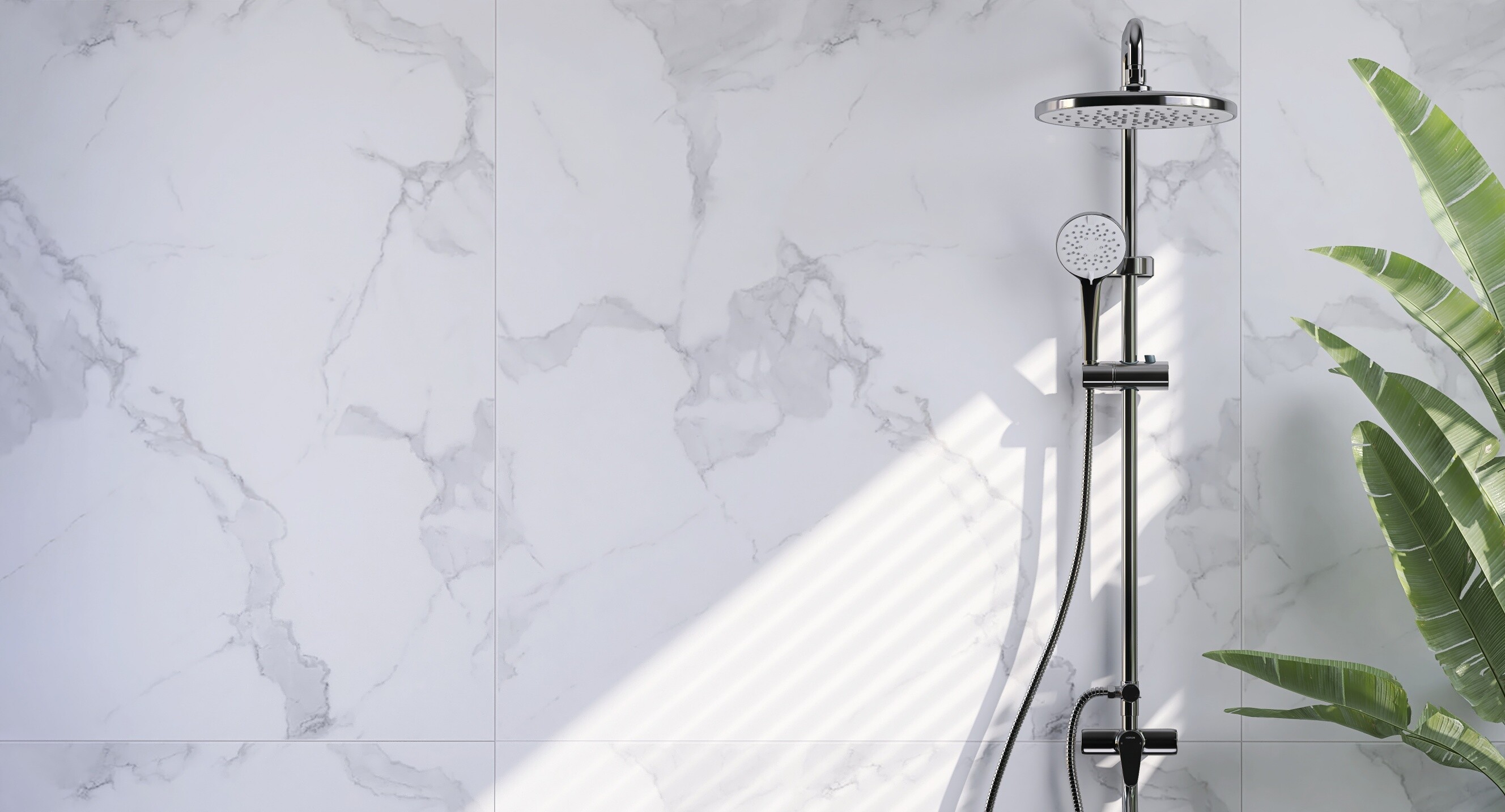 Chrome fixtures complement the clean, minimal shower design.