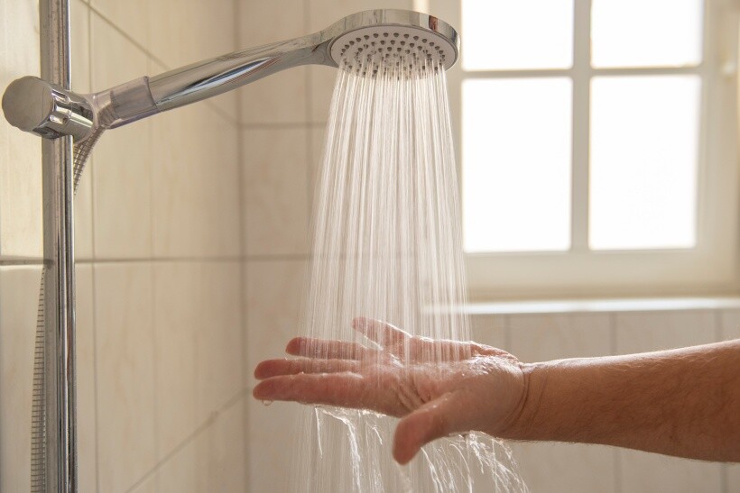 Power shower vs electric shower - Running water from a chrome power shower fixture 