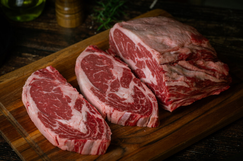scotch fillet vs porterhouse - close-up of raw scotch fillet cuts with thick marbling and fat cap