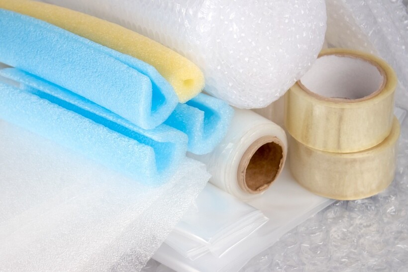 Assorted packing materials including bubble wrap and tape. - how to pack a TV for moving