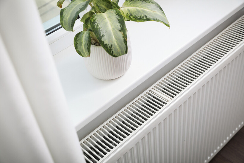 Space-efficient central heating radiator beneath a windowsill. - electric heater vs central heating