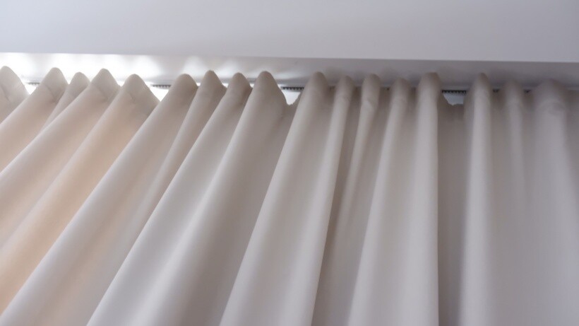 Curtain ideas - Beige hidden ripple fold curtains hanging from a ceiling-mounted rod