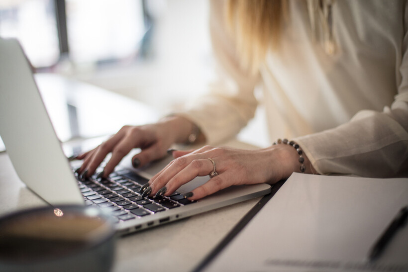 Close-up of hands on a keyboard. - moving tasks