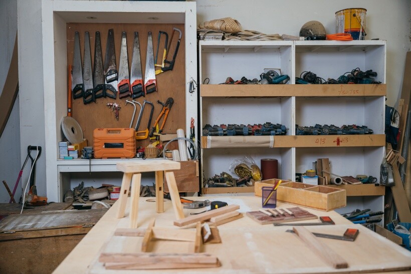 DIY loft bed - Interior of a woodworking shop with hand tools and materials.