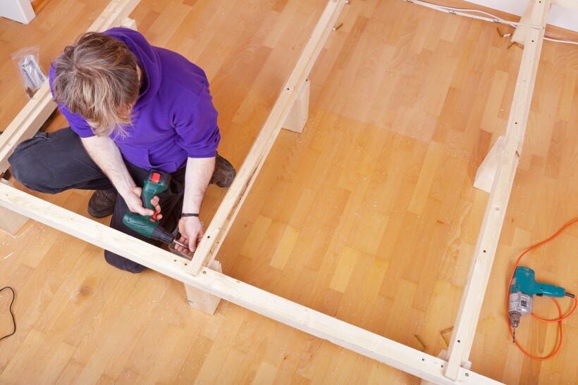 DIY loft bed - Overhead view of home furniture construction using power tools.
