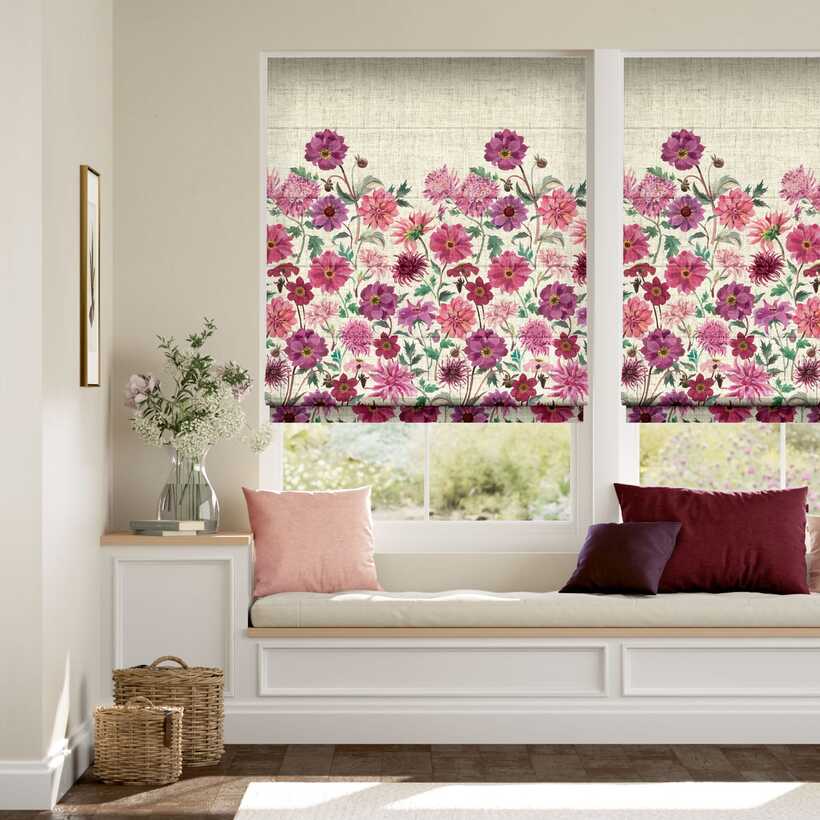 Window seat with floral roman blinds in a neutral-toned room. - decorative blinds