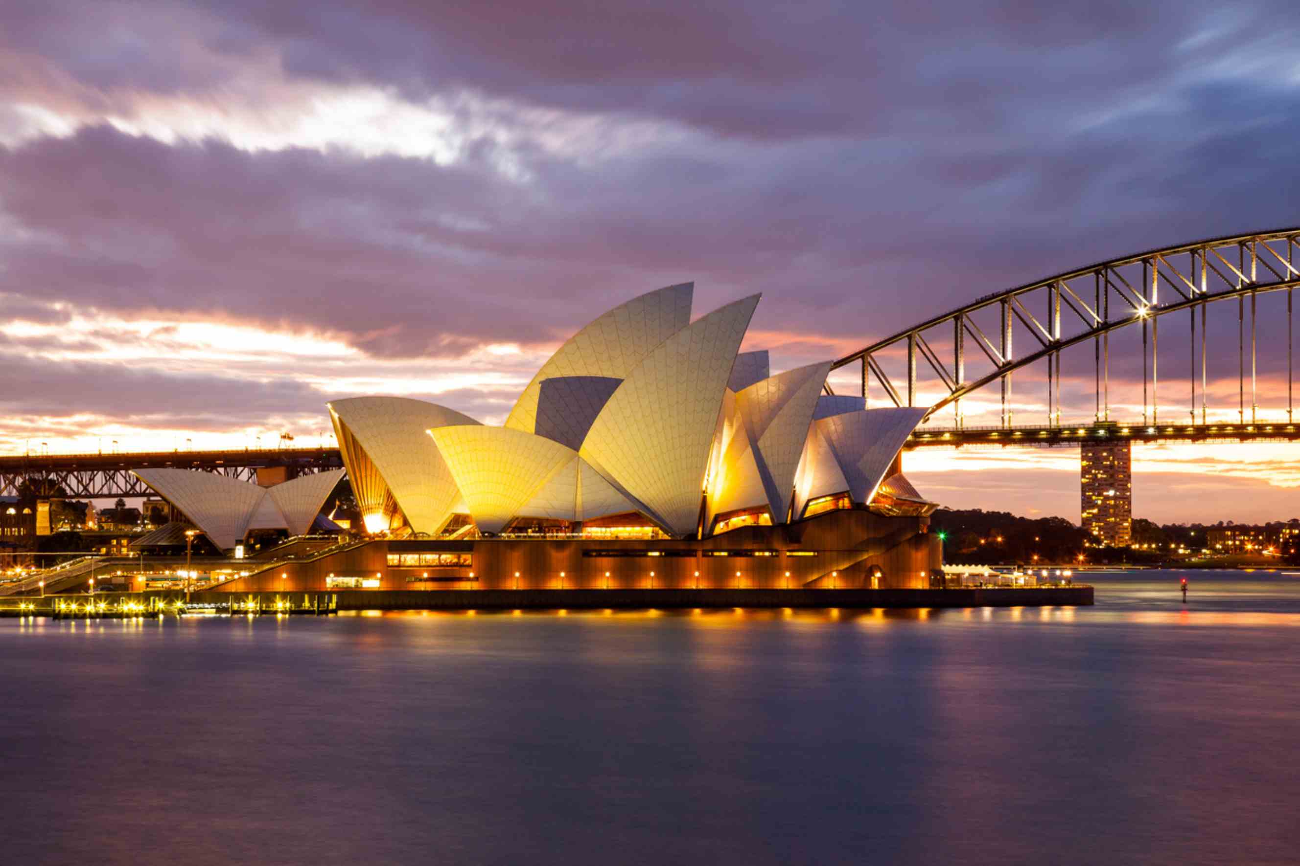 Sydney Opera House and Harbour Bridge at sunset, representing a popular destination for Brisbane to Sydney removals.