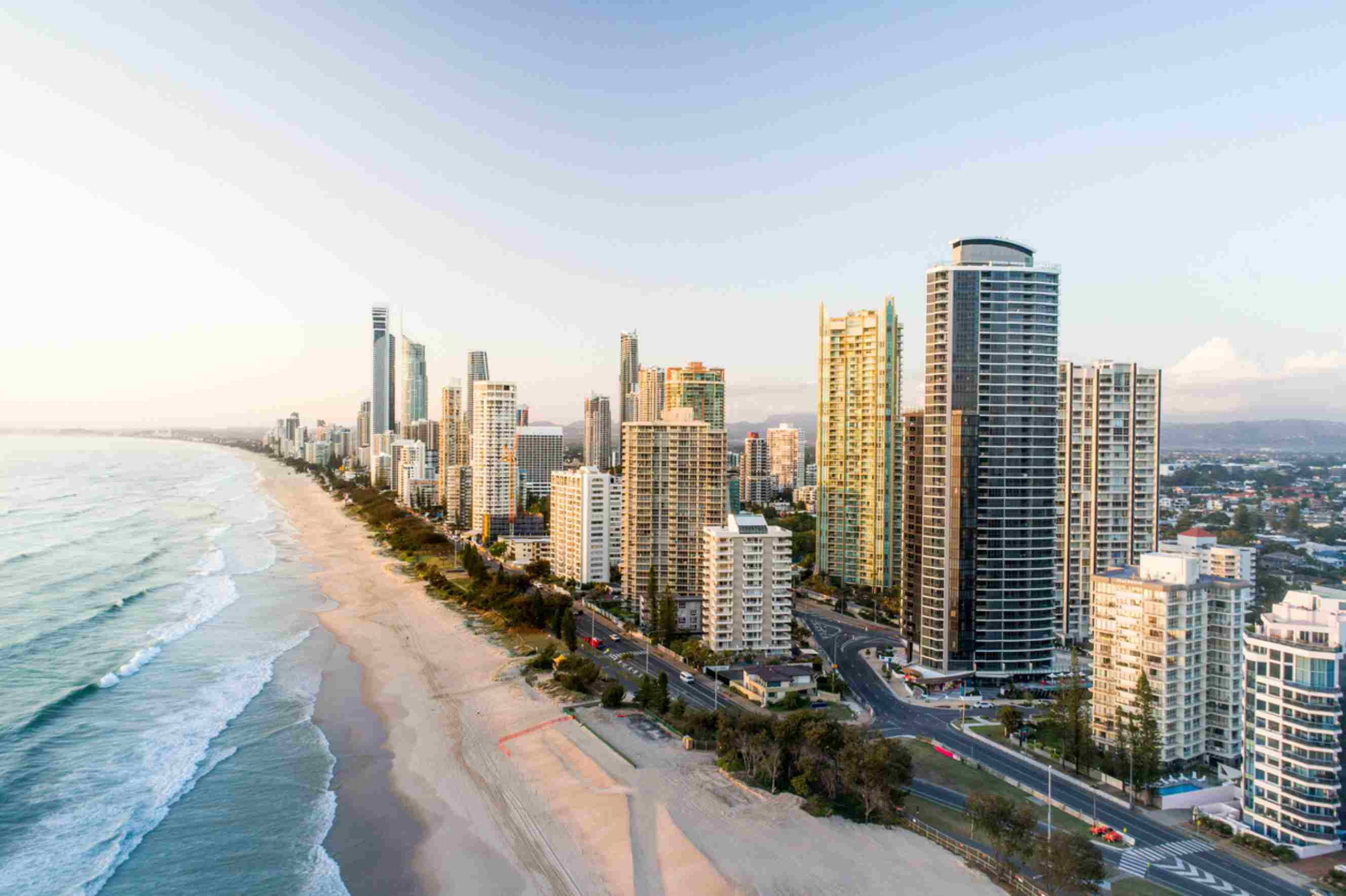 Gold Coast beachfront skyline with high-rise apartments, a popular destination for people moving from Sydney to the Gold Coast