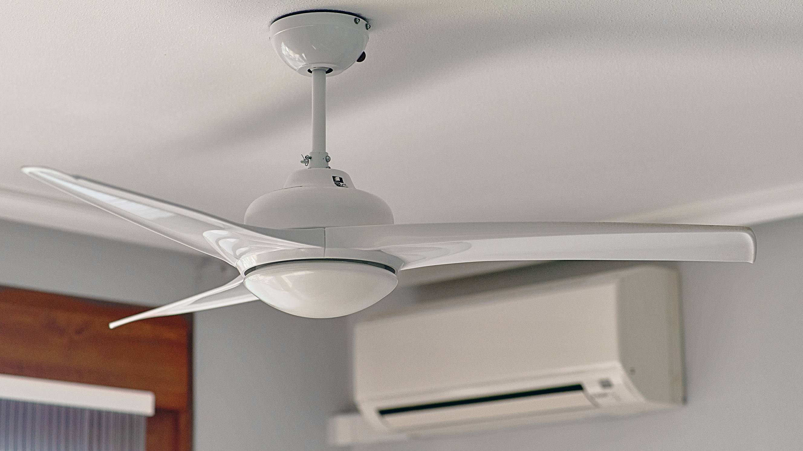 A ceiling fan and an air conditioner cooling the same room