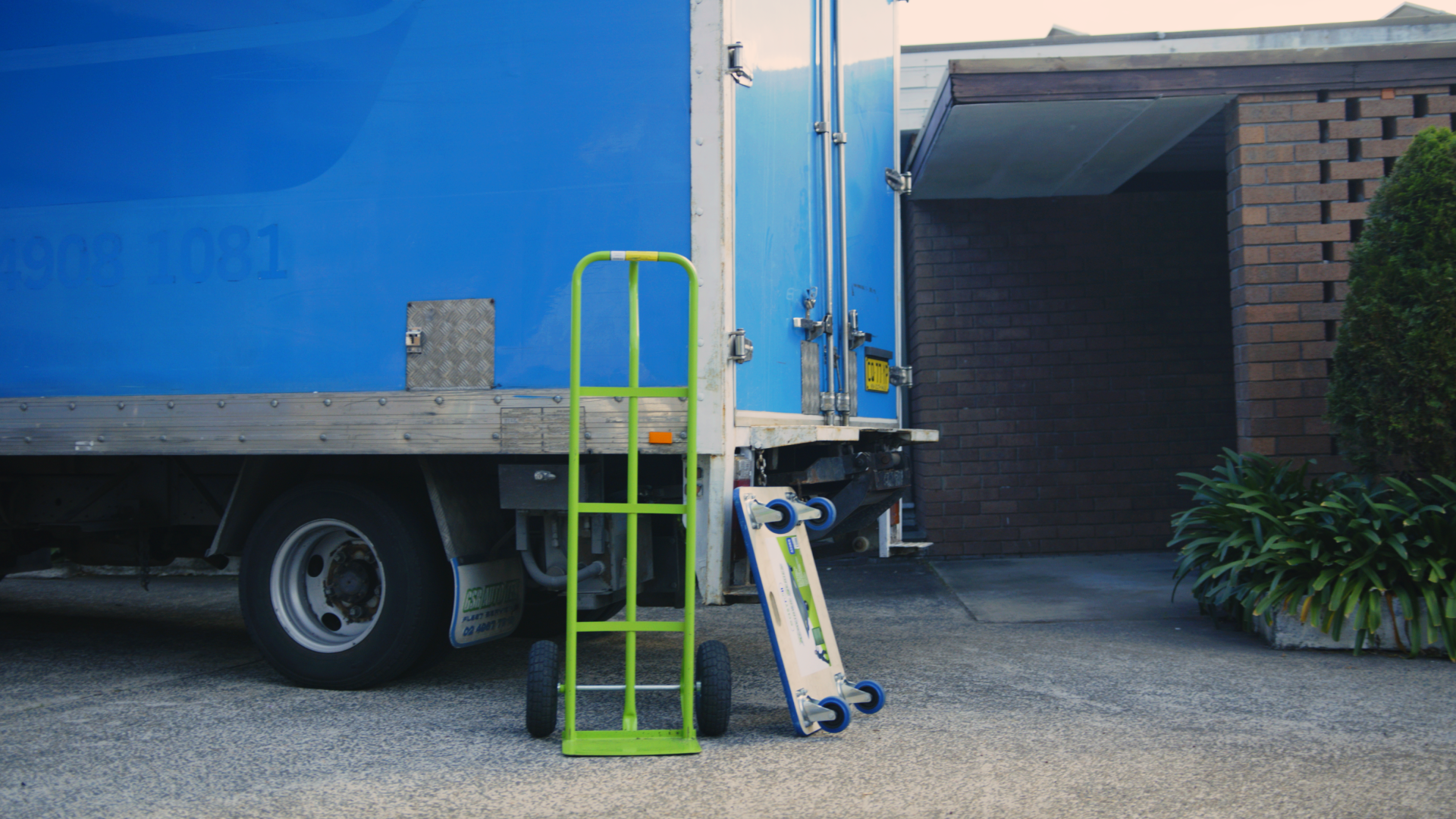 cost to move fridge - Moving truck with hand truck and dolly prepared for appliance transport