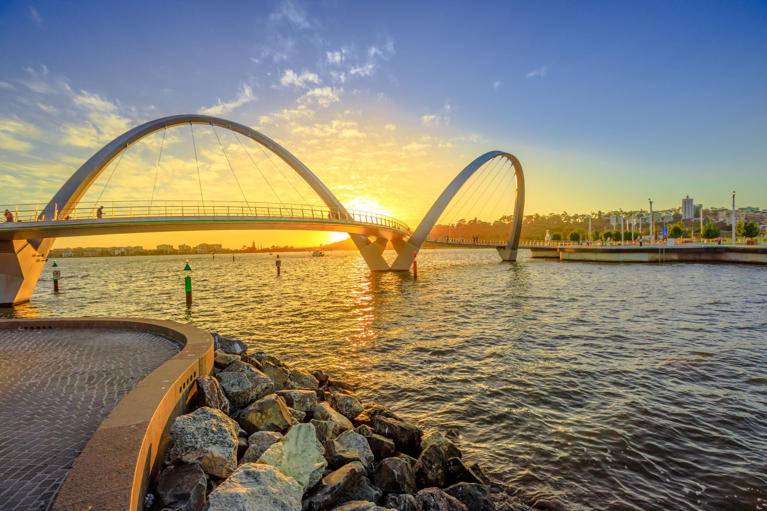 Scenic and iconic Elizabeth Quay Bridge at sunset light on Swan River at entrance of Elizabeth Quay marina representing Sydney to Perth removal services.