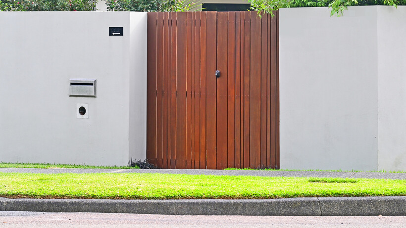 A secure fence-mounted letterbox integrated into a modern front gate. - how to replace a letterbox