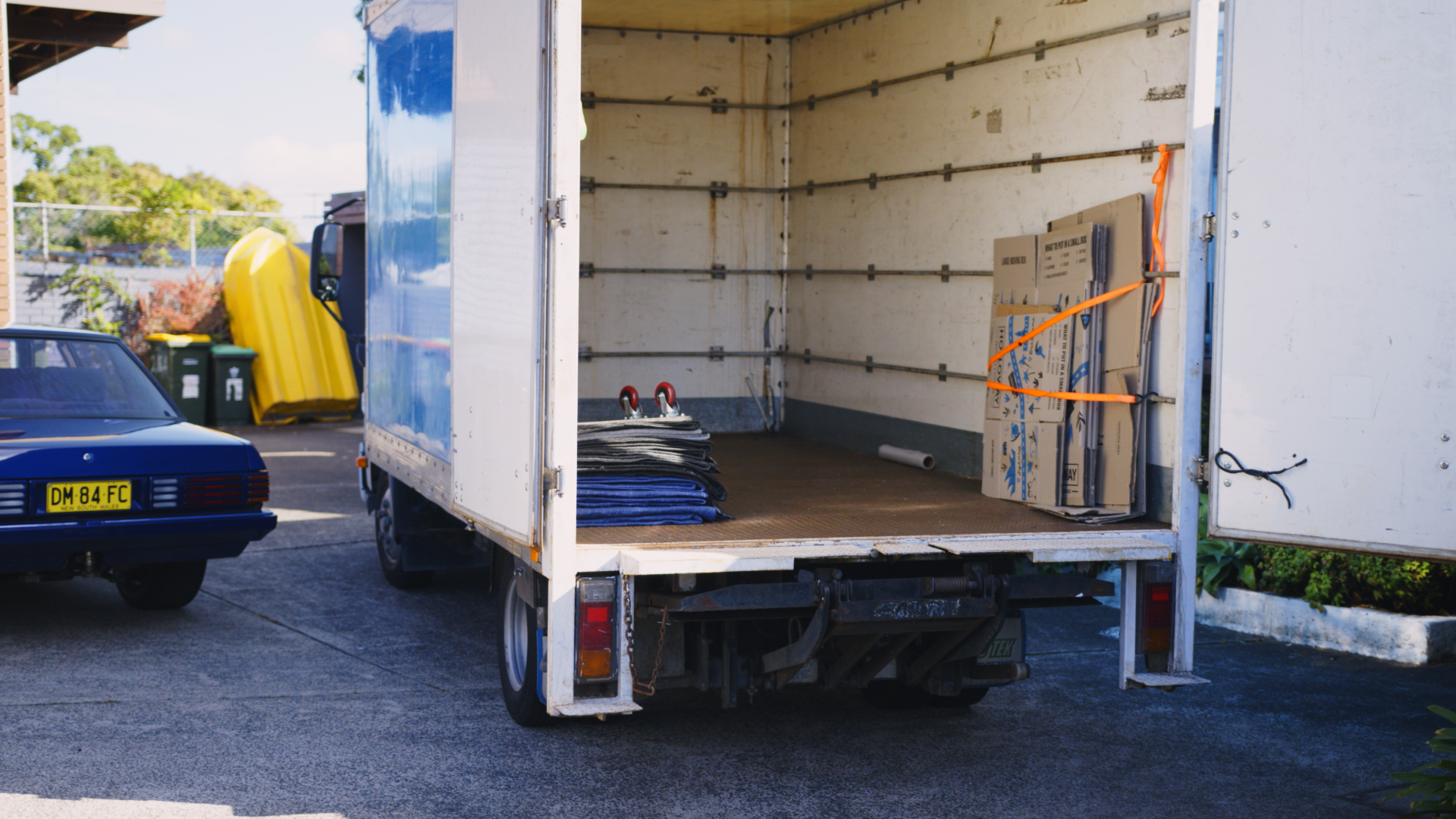 how to pack a moving truck - Interior view of a moving truck layout with moving supplies neatly arranged