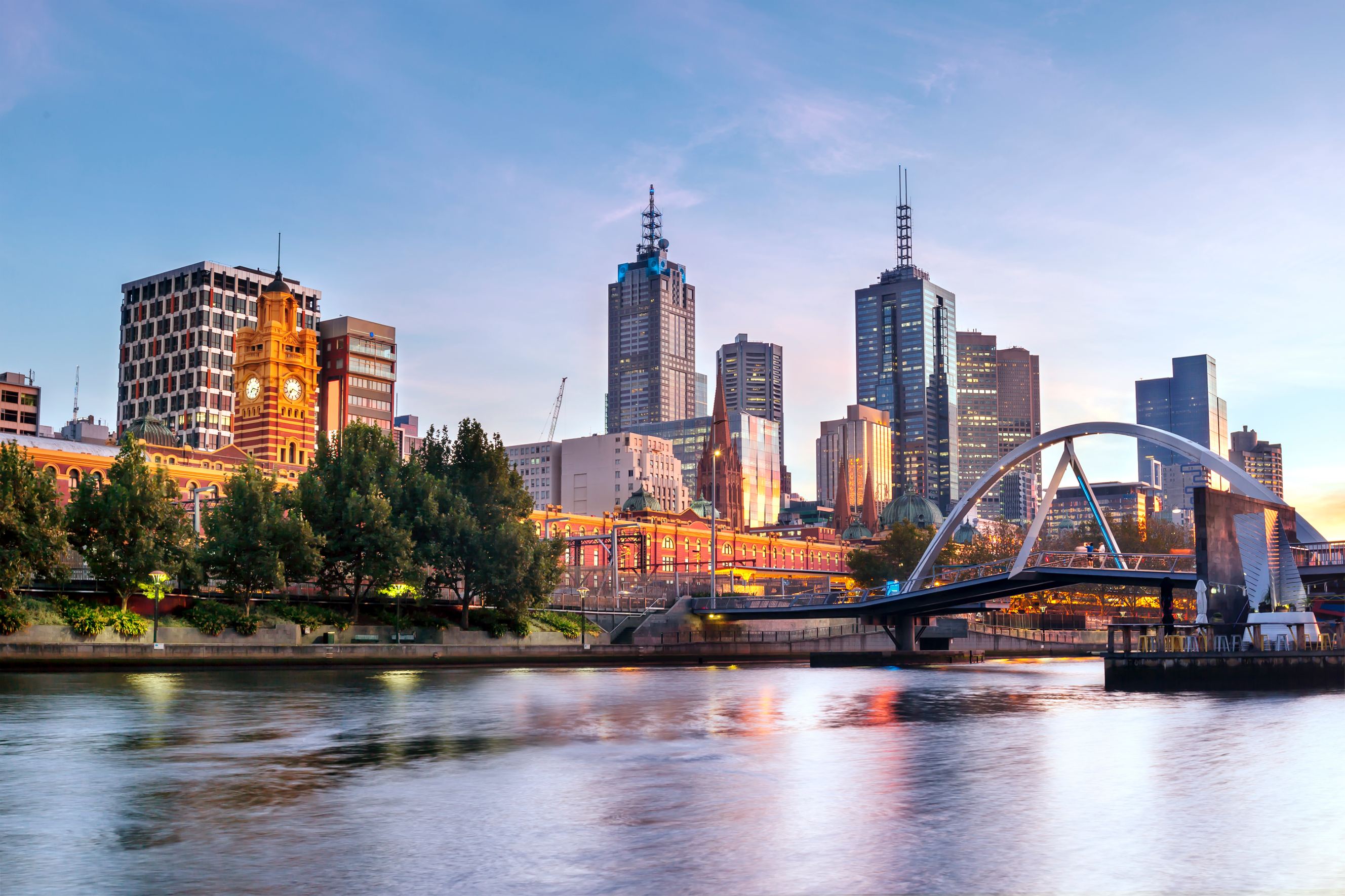 Melbourne, Australia, in early morning light. Yarra River, towards Flinders Street Station representing Canberra to Melbourne removal services.