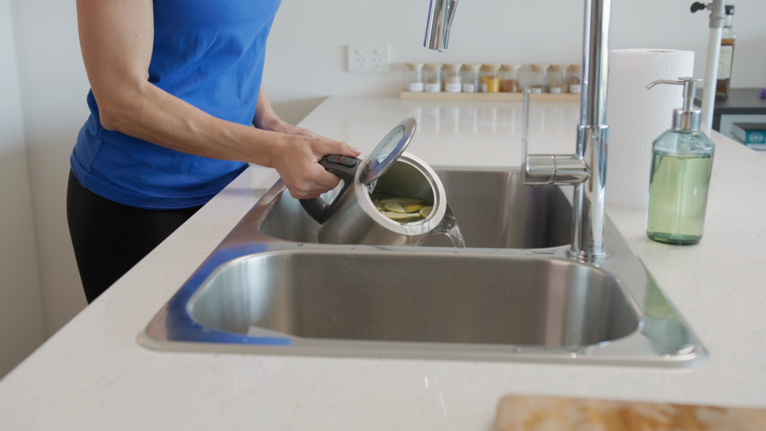 throwing out the water after boiling lemons in a kettle to descale it