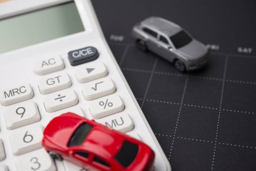 car diagnostic test cost - Calculator with toy cars on vehicle expense chart