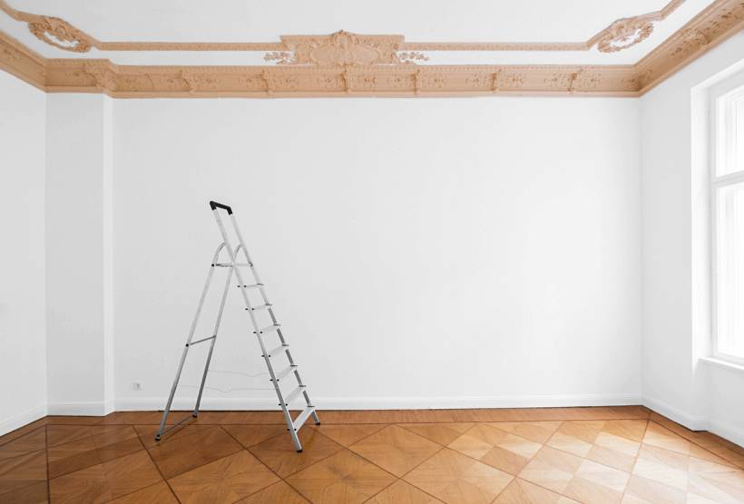 how to limewash walls - Empty white room with ladder and ornate ceiling trim