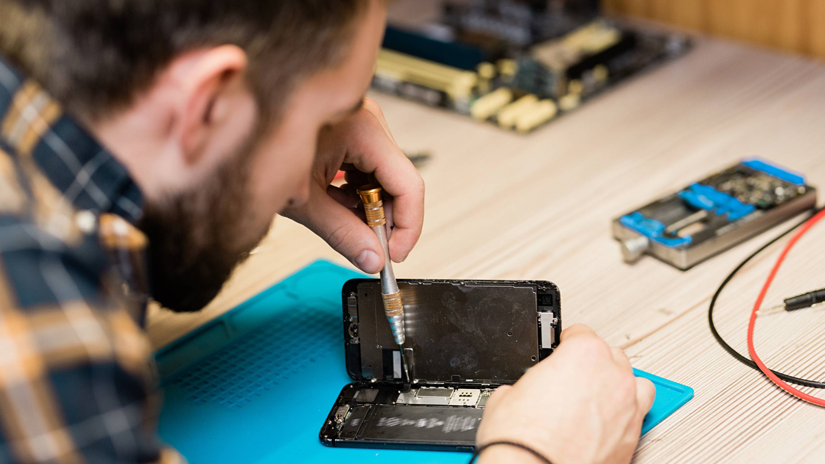 a man repairing an iPhone